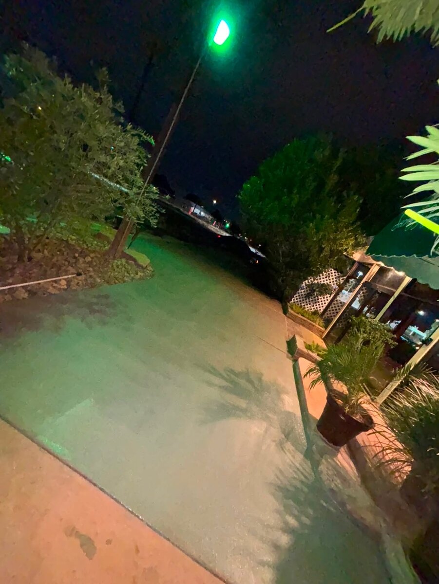 Fresh gray finish after a concrete resurfacing and recoating project